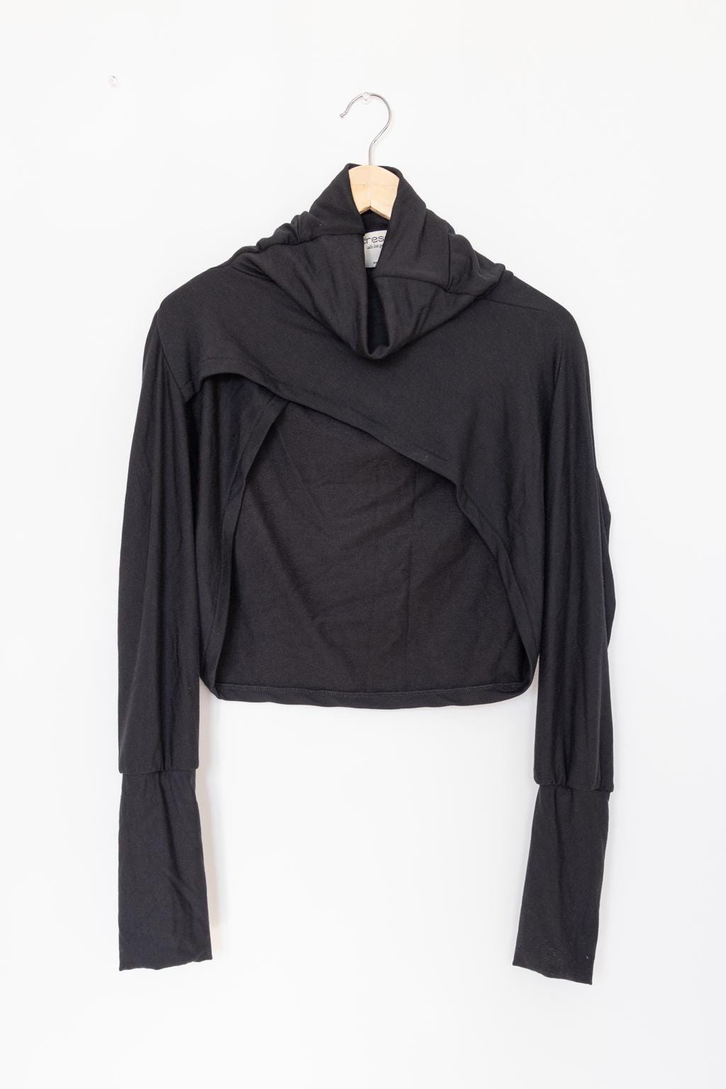 Black bolero sweater with a high collar, turtle neck