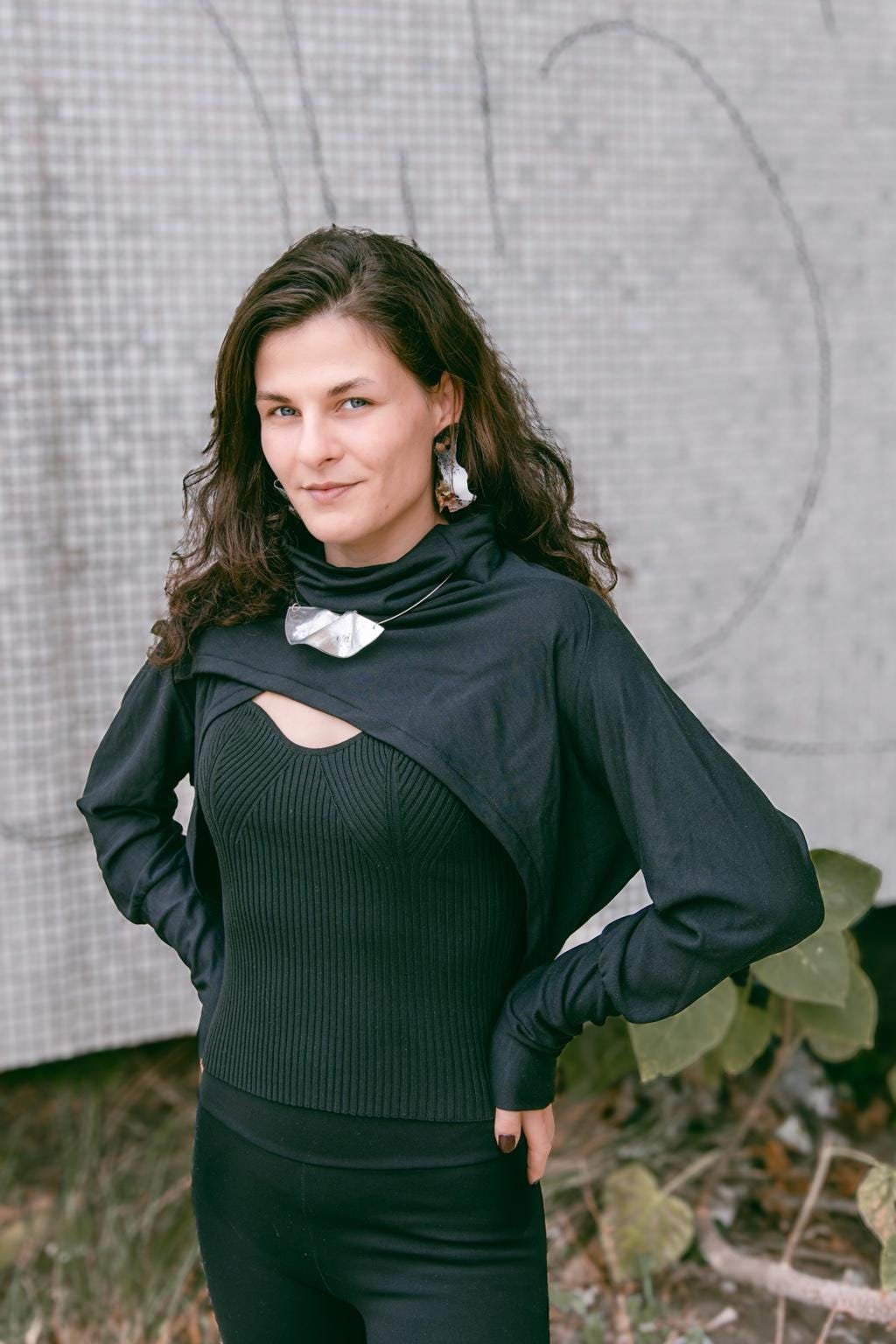 Black bolero sweater with a high collar, turtle neck