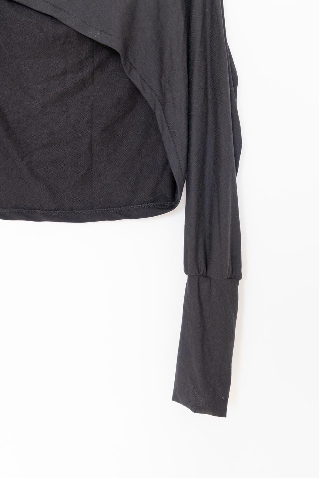 Black bolero sweater with a high collar, turtle neck